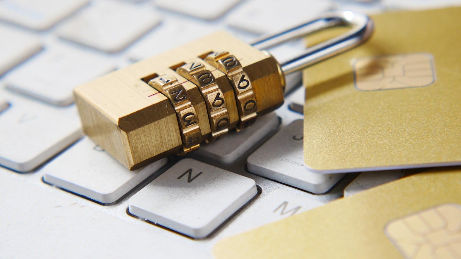 Lock and key on dark background, evoking password security and protection