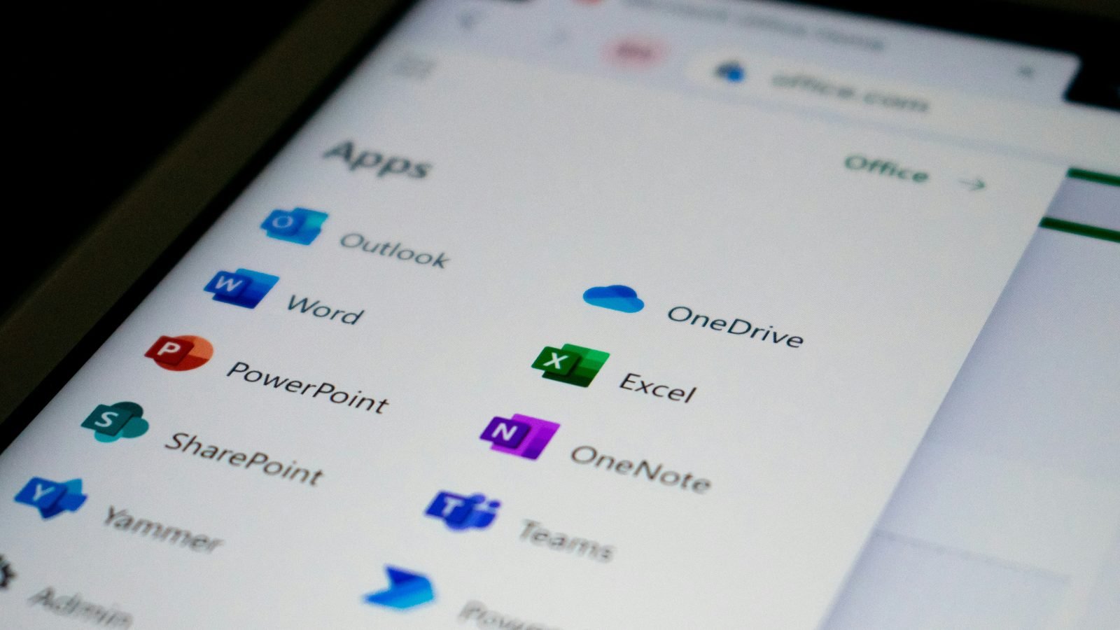 Close-up of a phone screen showing colored data rows, evoking Airtable's grid view
