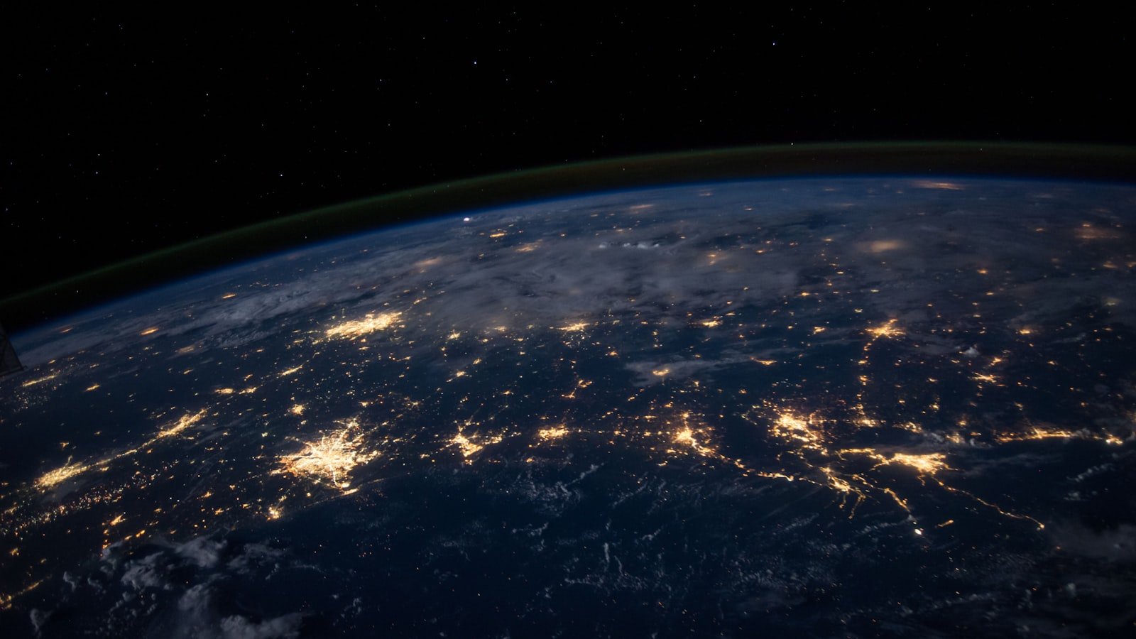 Earth from space with city-light networks, evoking Cloudflare's global PoP coverage