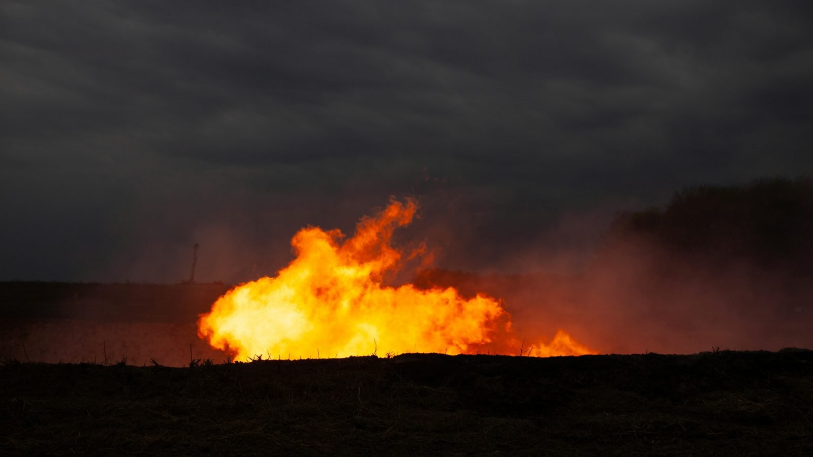 Natural gas flare against dark sky, illustrative for a Crusoe Cloud review.
