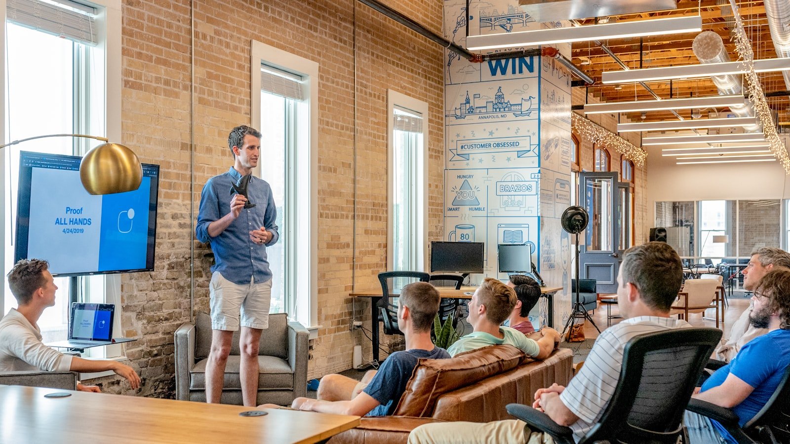 Team collaboration on laptops evoking unified DevOps platform workflow