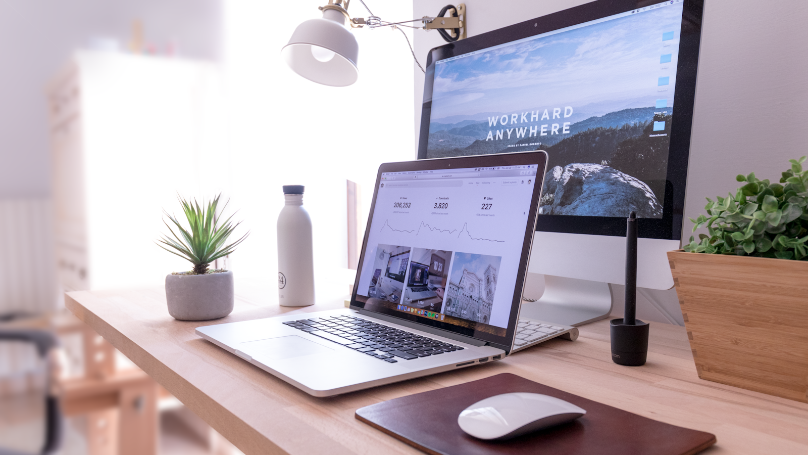 Workspace with laptop displaying website builder, evoking accessible web hosting for beginners