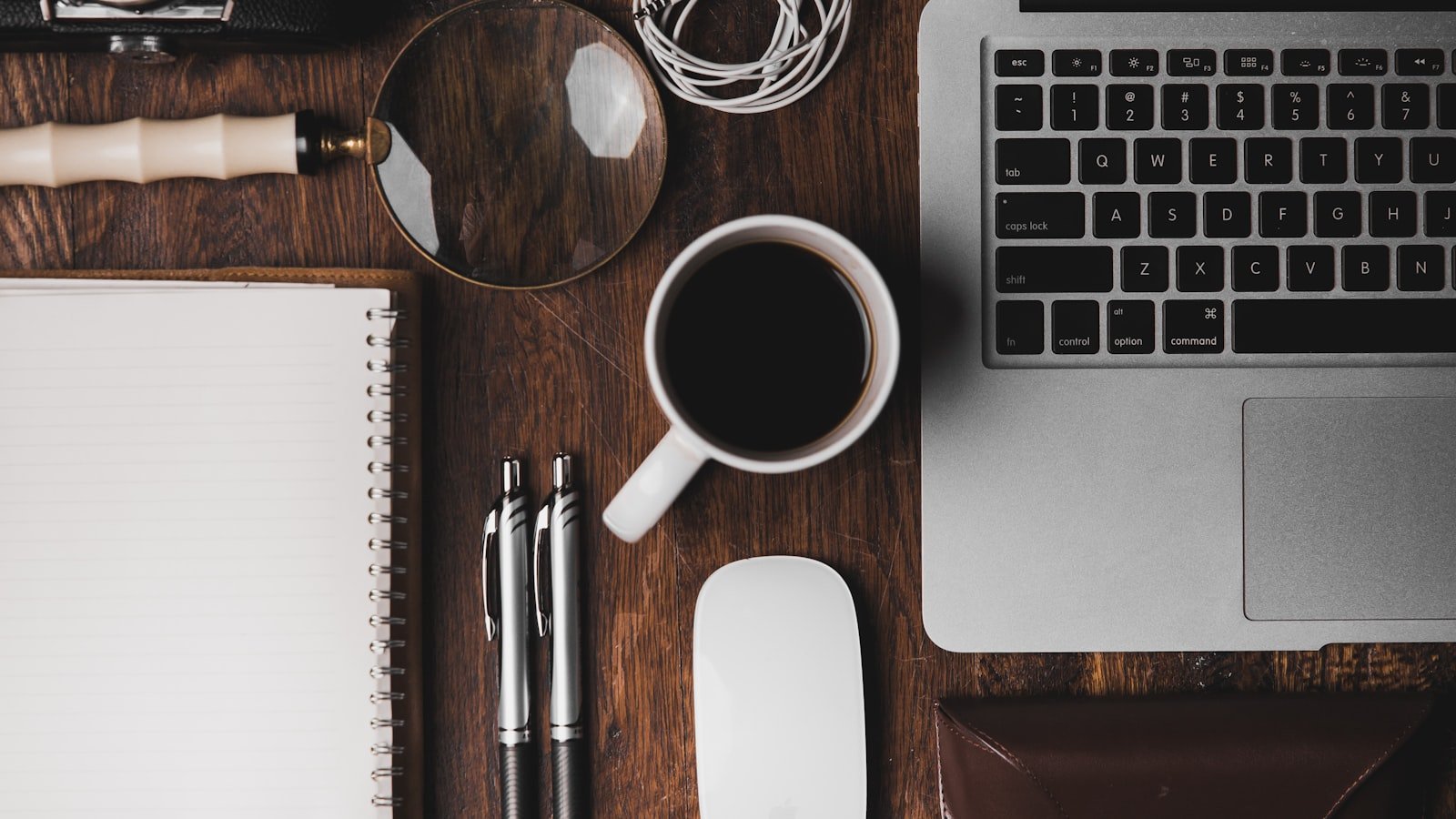 Clean office workspace with laptop and notebook, evoking Microsoft 365 productivity
