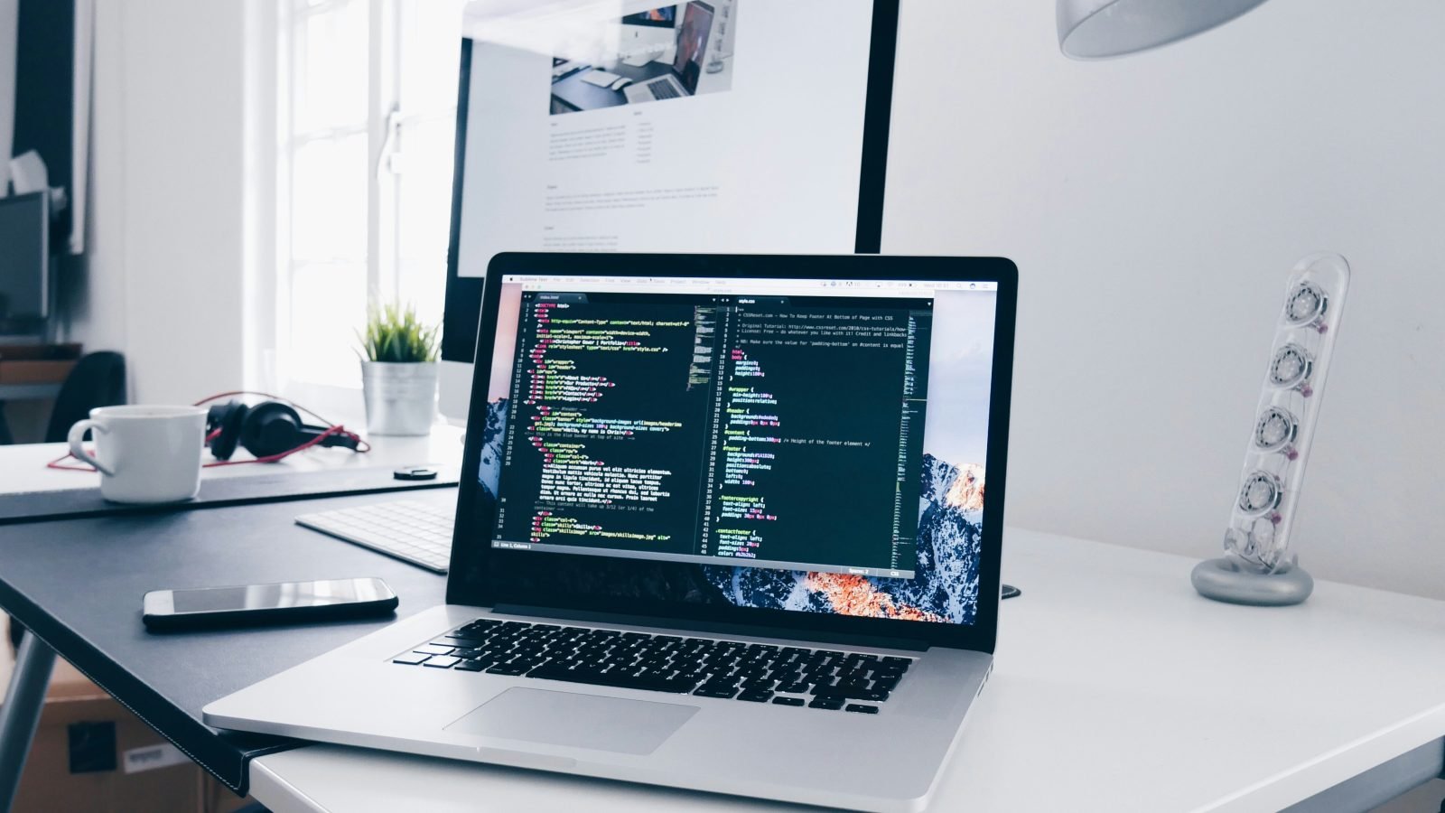 Developer workspace with code on a MacBook, illustrative for a Modal Labs review.